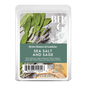 Better Homes & Gardens Sea Salt and Sage scented wax cubes in a clear plastic clamshell package, featuring a label with sage leaves, lavender, and white salt crystals on a gray background.