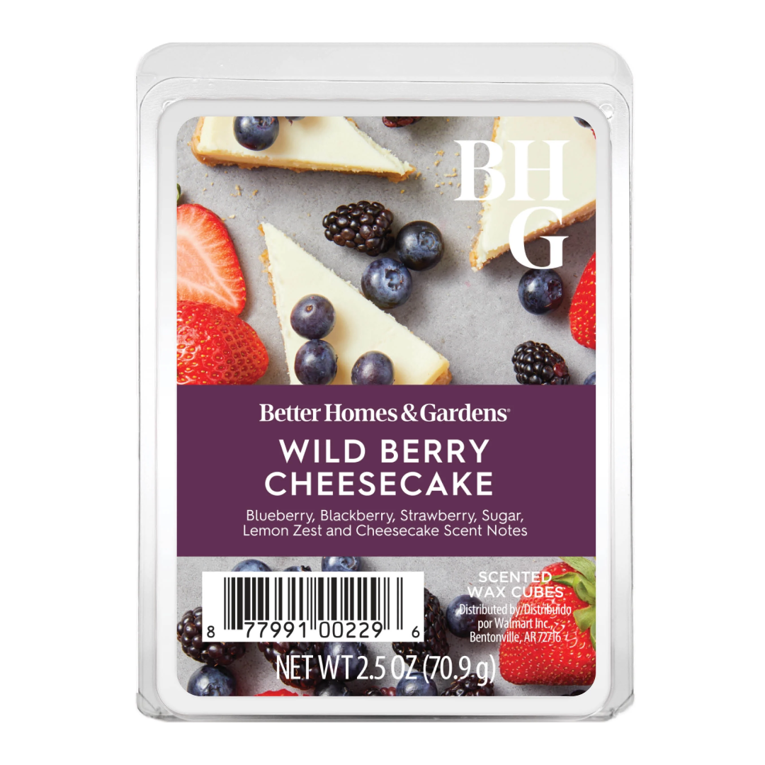 Better Homes & Gardens Wild Berry Cheesecake scented wax cubes in a clear plastic clamshell package, featuring a purple label with product details and berry-and-cheesecake imagery.