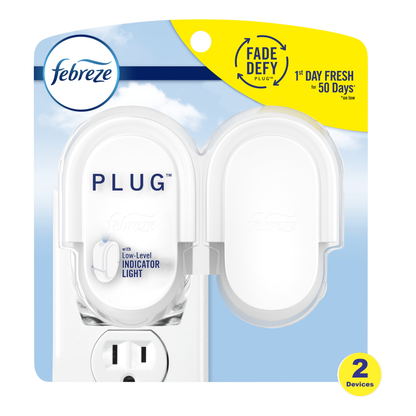 Febreze Plug 2-pack in retail packaging, featuring two white plug-in fragrance devices with one showing a low-level indicator light, on a blue and yellow cardback.