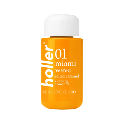 A 100 mL bottle of Holler Miami Wave Salted Caramel cleansing shower oil, featuring a vibrant orange body and a white cap, set against a plain white background.