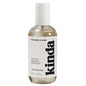 Bottle of 'kinda' hair and body mist on a white background