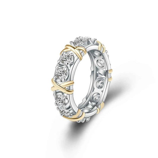 Two-tone ring with diamonds on a white background